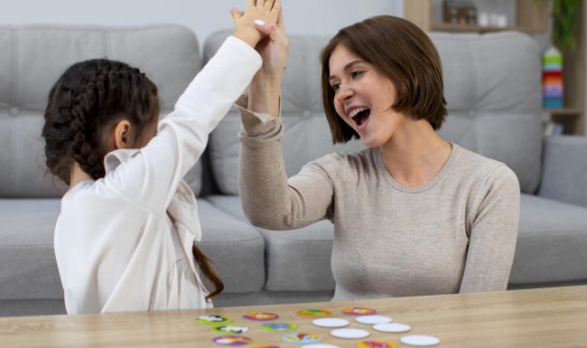 front-view-mother-girl-playing-game